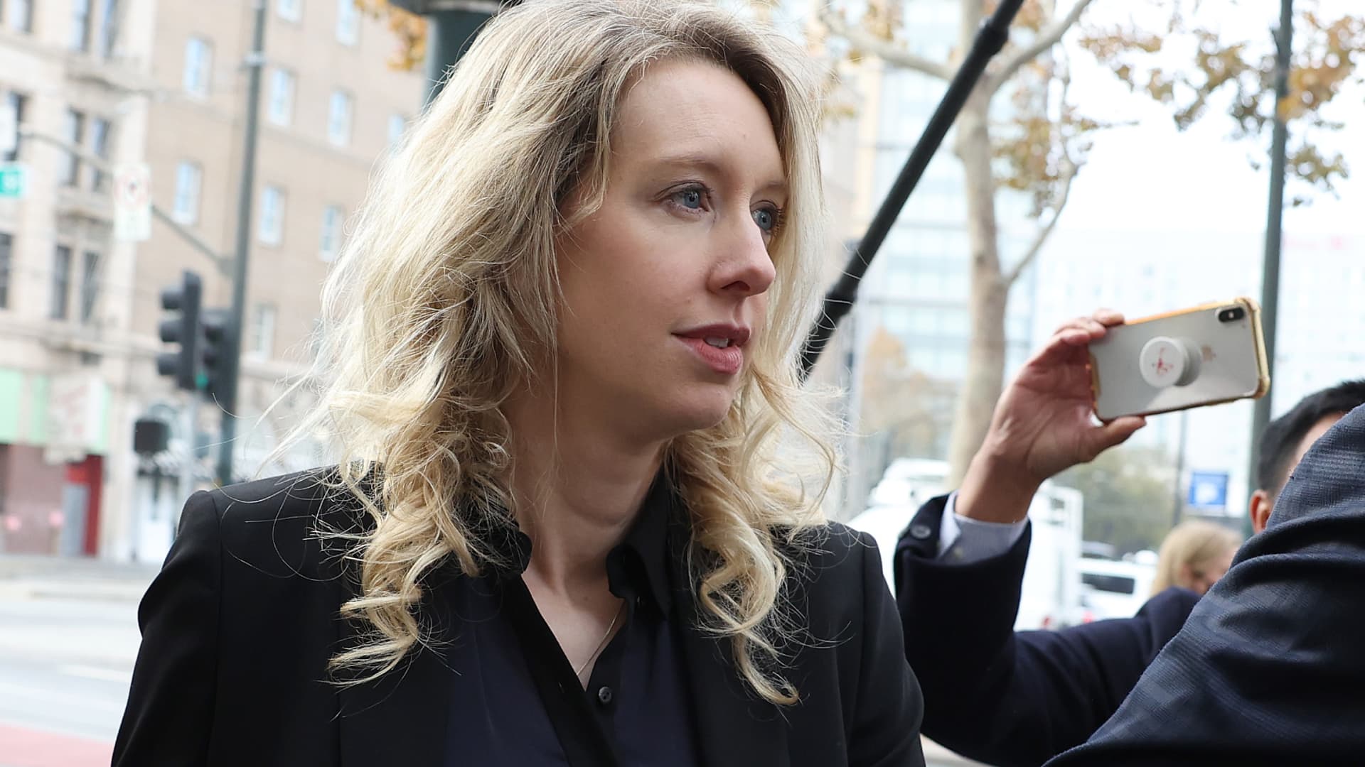 Elizabeth Holmes denied request to avoid prison and faces massive restitution bill.