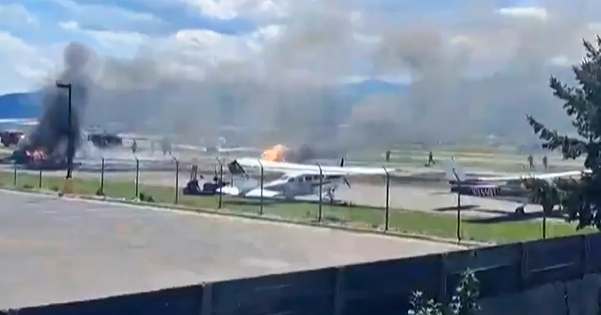Plane crashes into parked aircraft during landing at Montana airport, igniting fire