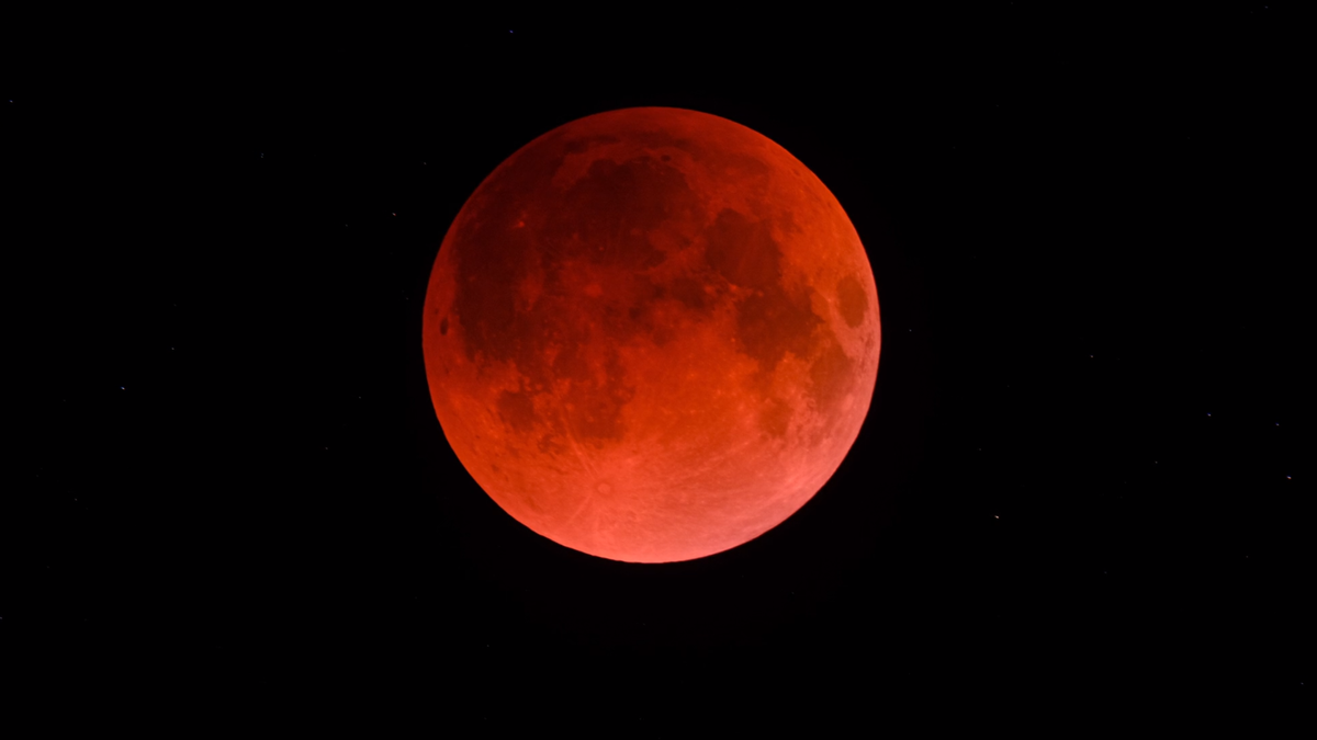 "Captivating Lunar Spectacles: Blood Red Eclipse and Earthshine Glow"