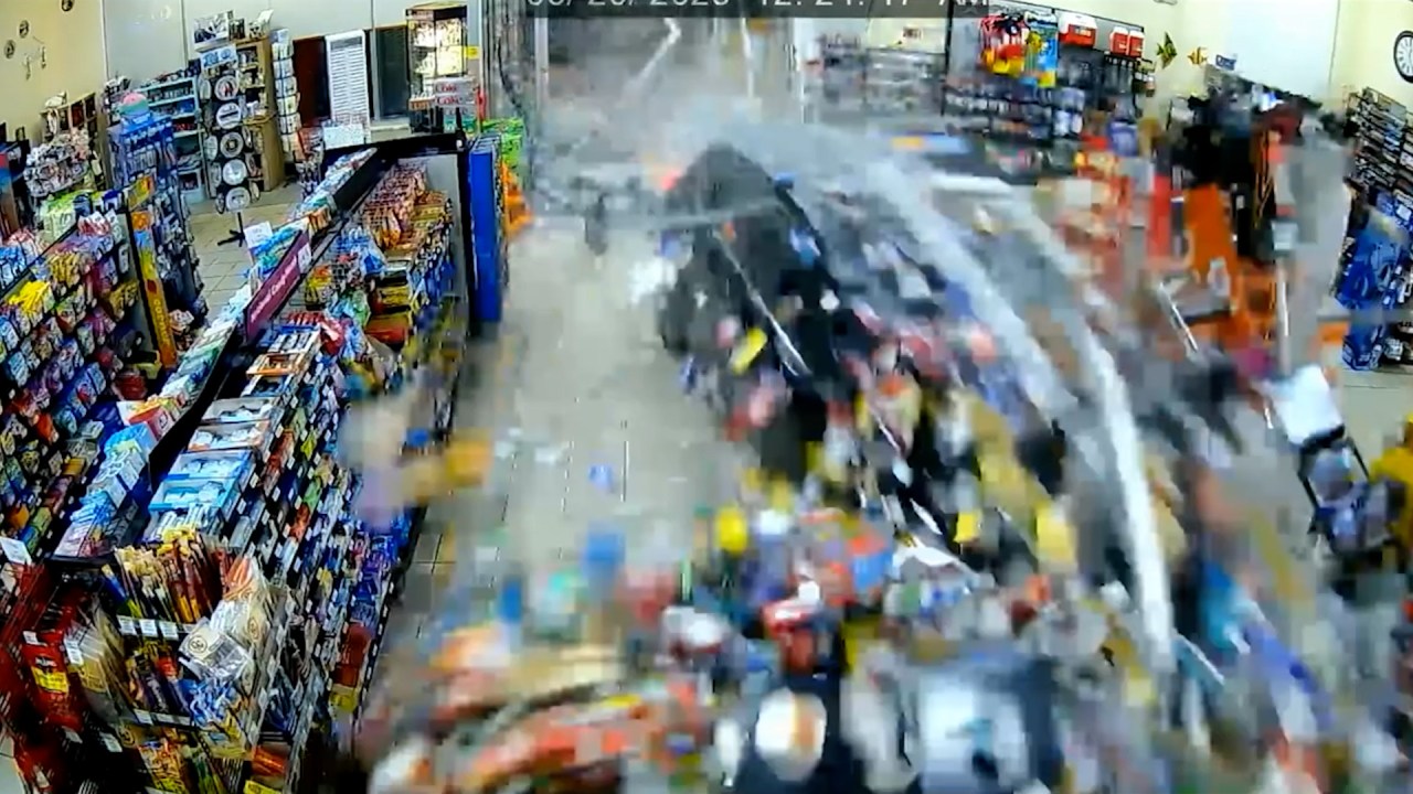 Car crashes into Seffner gas station, pinning shopper in shocking video footage.
