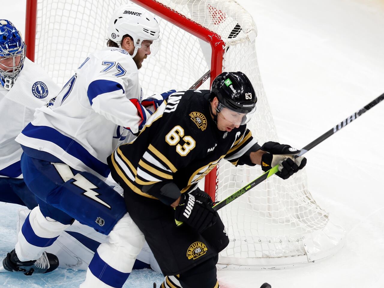 "Marchand's Milestone: Lightning Stars Reflect and Bruins Prepare for 1000th Game"