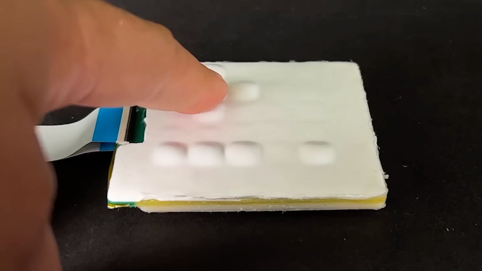 Liquid-Filled Pop-Up Buttons Could Revolutionize Smartphone Keyboards