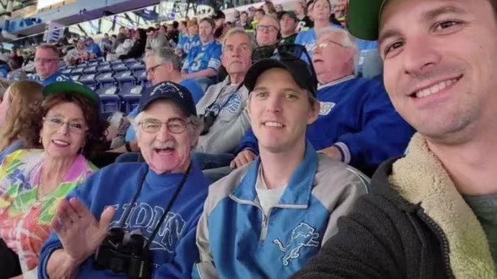 "Detroit Lions' Historic Playoff Win Unites Fans in Bittersweet Celebration"