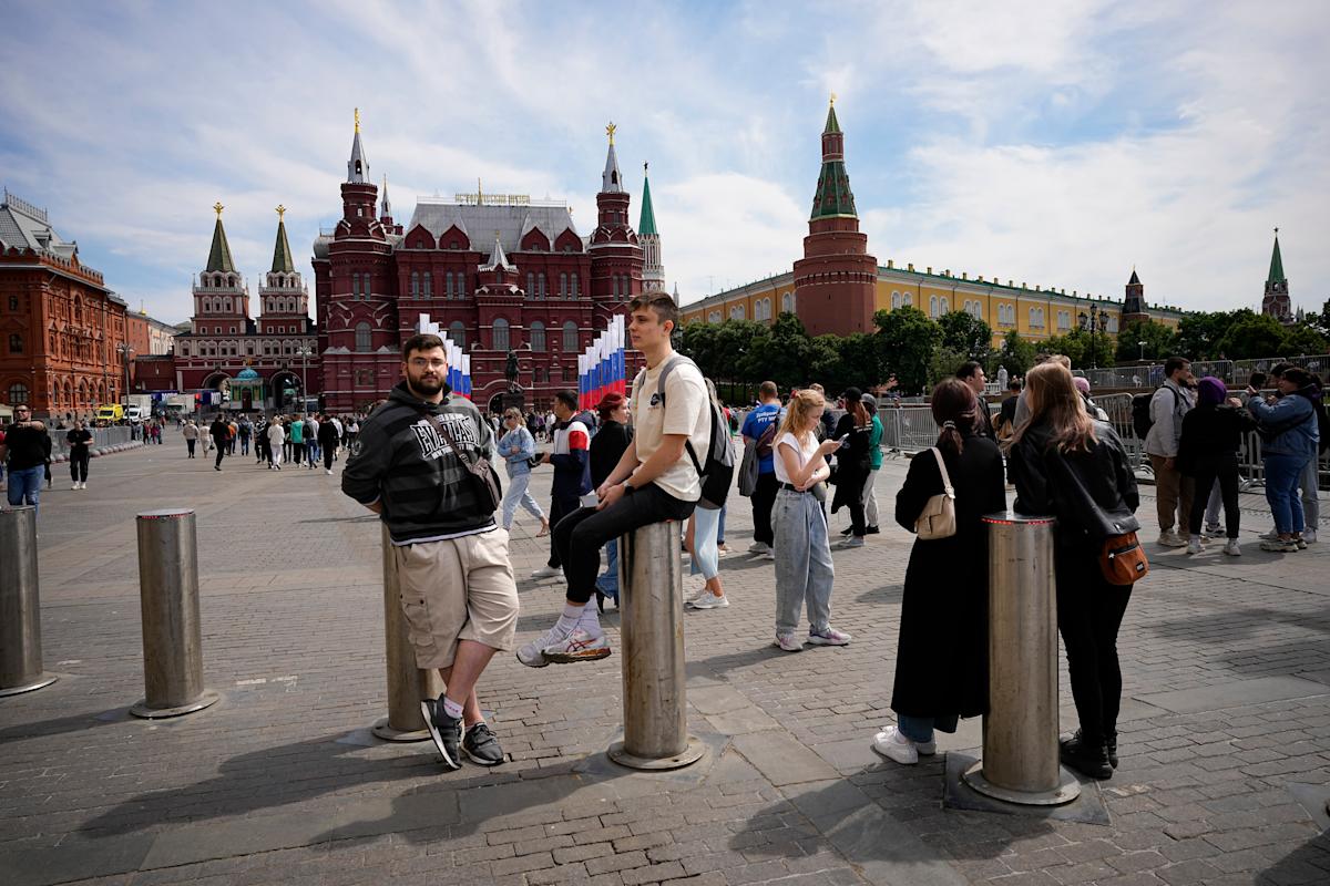 Putin stirs patriotic support for troops in Ukraine on public holiday.
