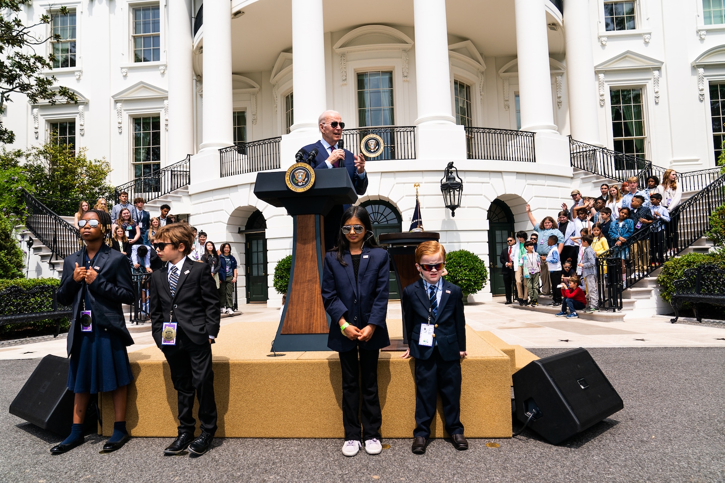 Biden engages with children in Q&A session.
