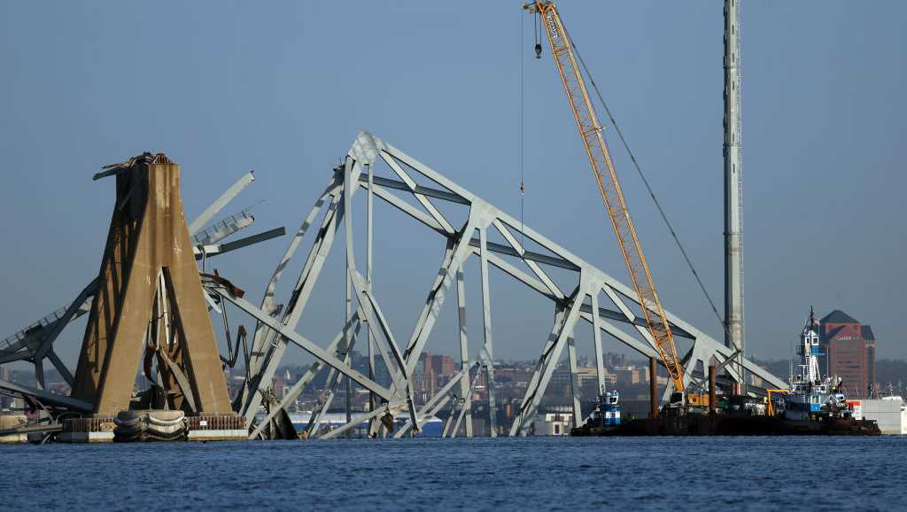 "Baltimore Bridge Collapse: Massive Crane Removes Wreckage as Port Closes, Affecting Cruise Routes"