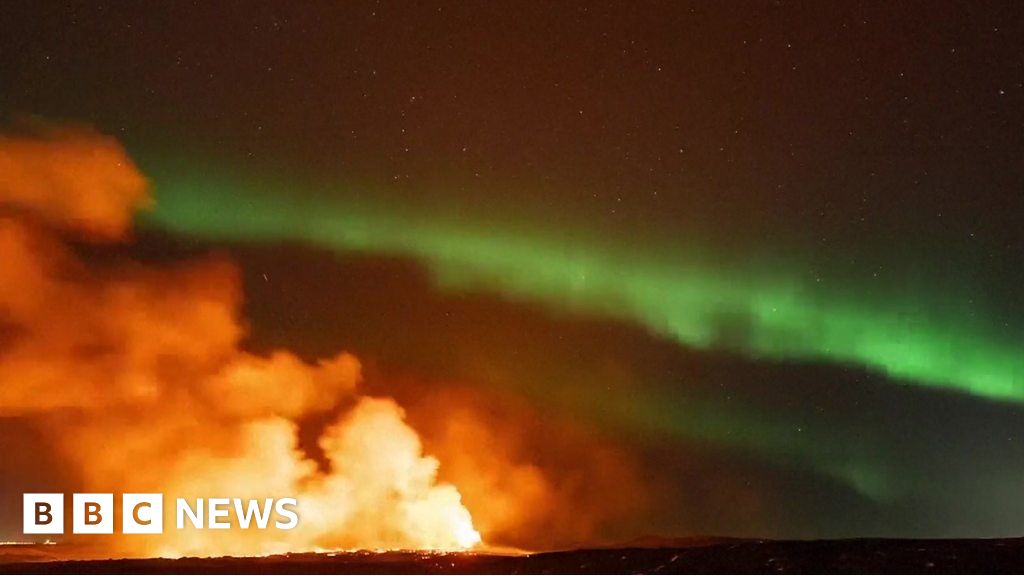 Featured image for "Northern Lights Dance Above Erupting Volcano in Iceland"
