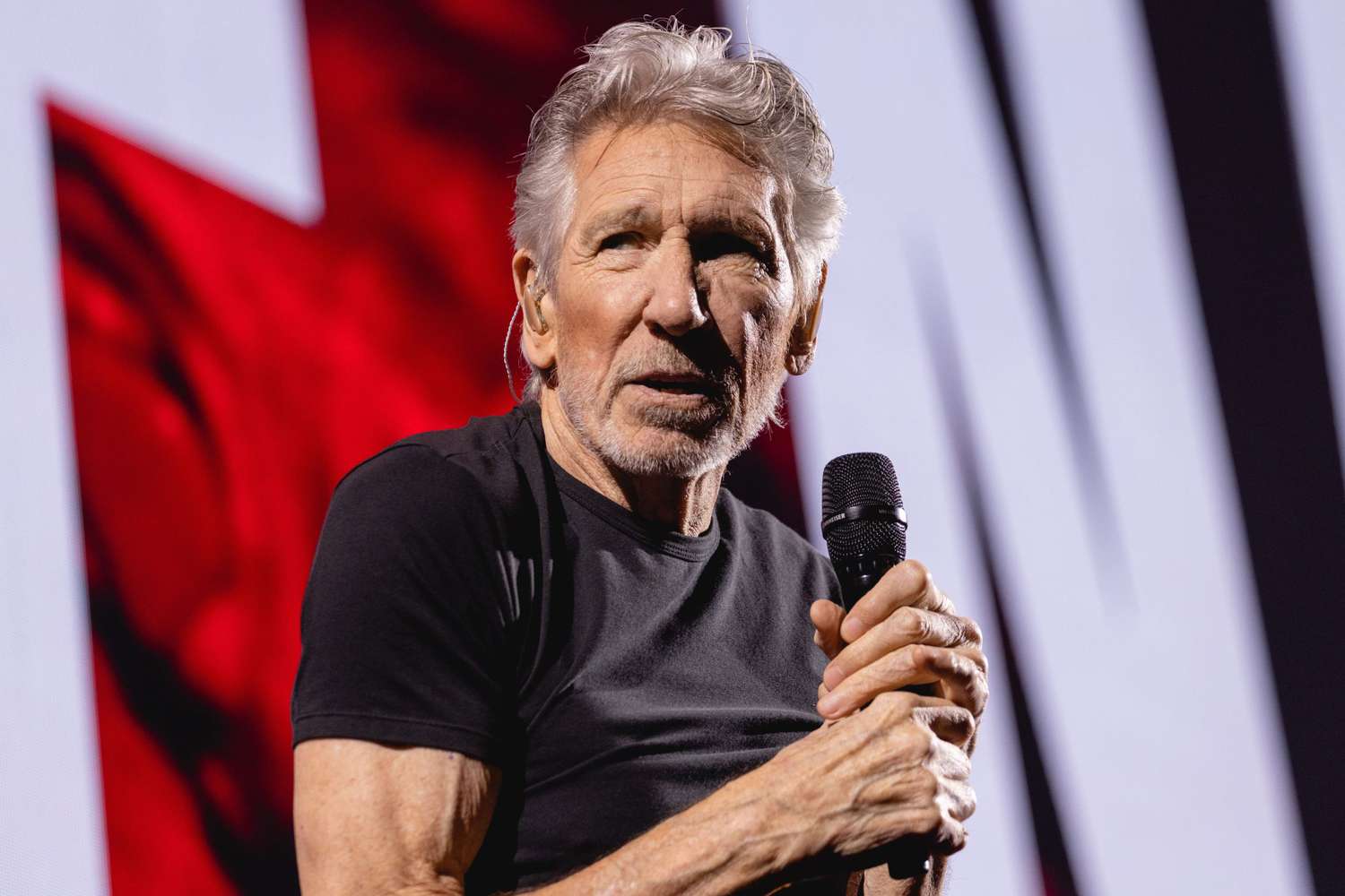 Roger Waters defends satirical Nazi costume amidst controversy.