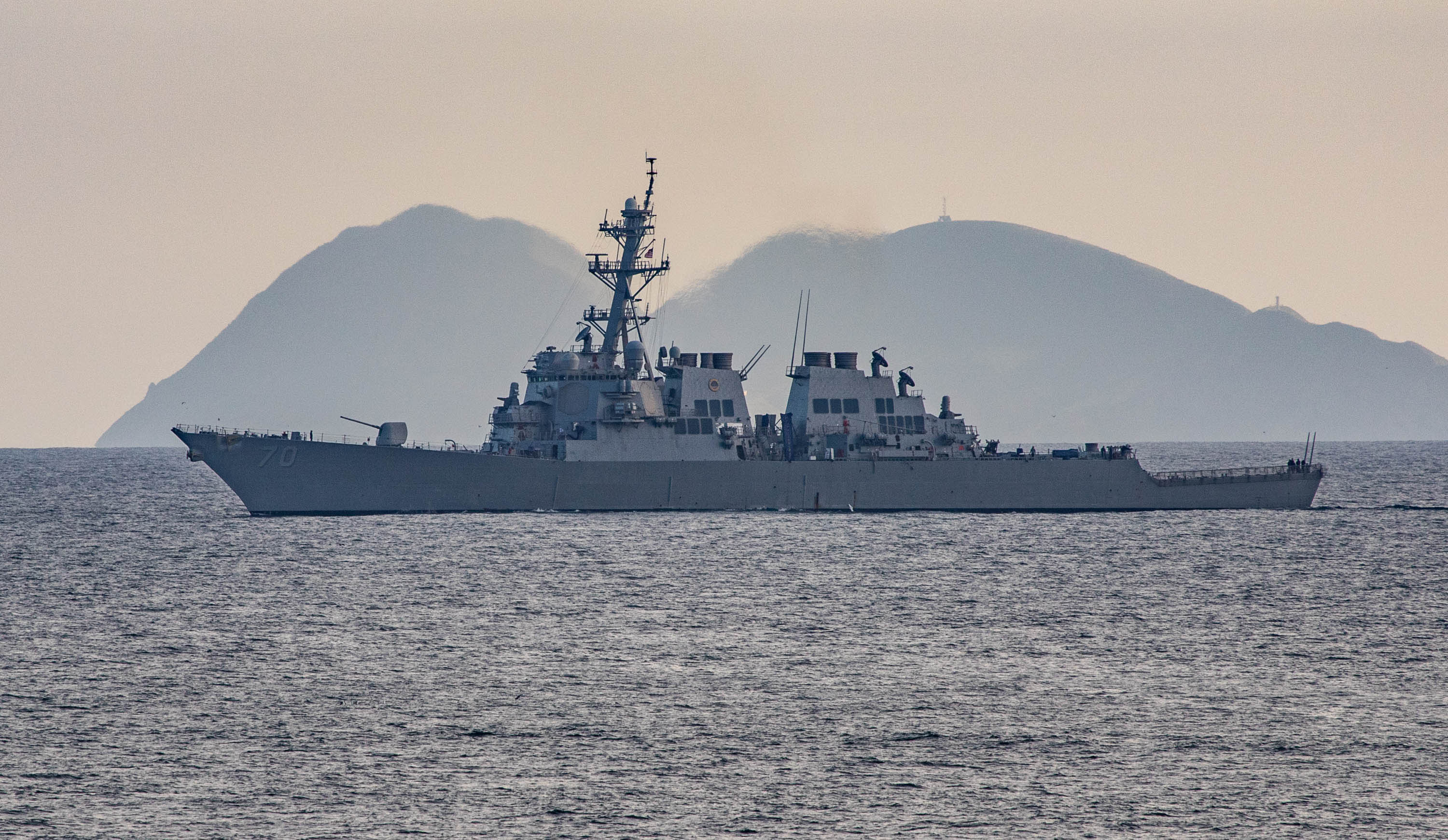 China Warns Off US Warship in South China Sea, Escalating Tensions