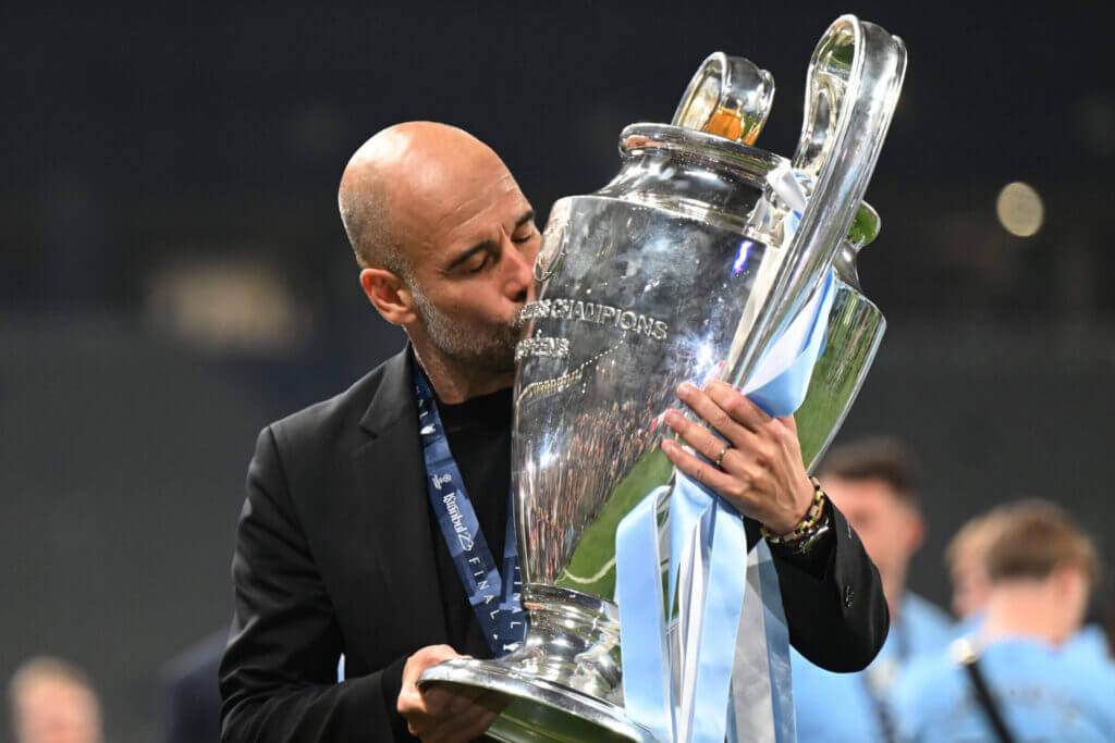 Featured image for Pep Guardiola leads Manchester City to historic treble and Champions League victory.
