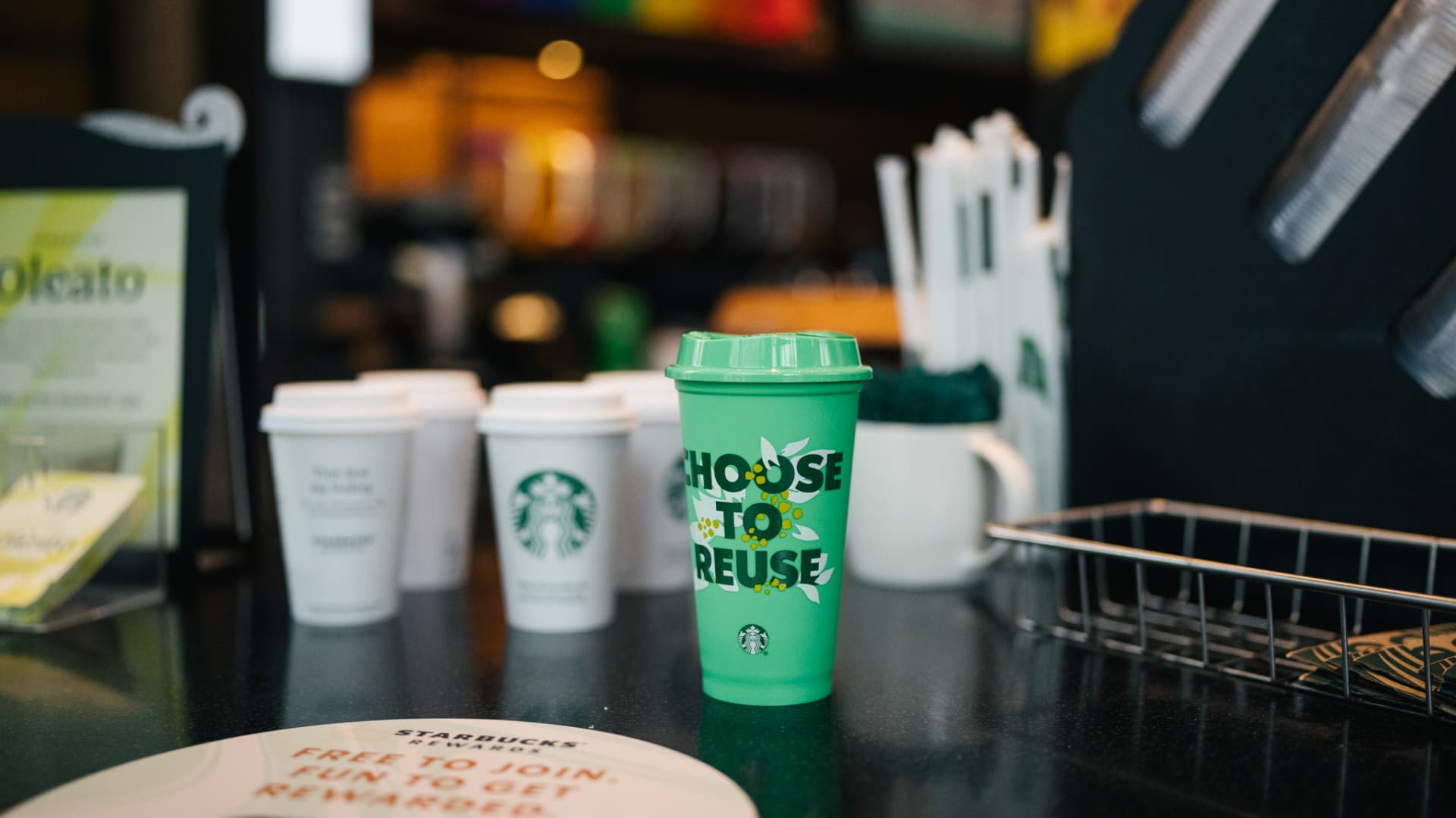 Featured image for Starbucks' iconic cup faces climate challenge with surge in mobile and drive-thru orders.