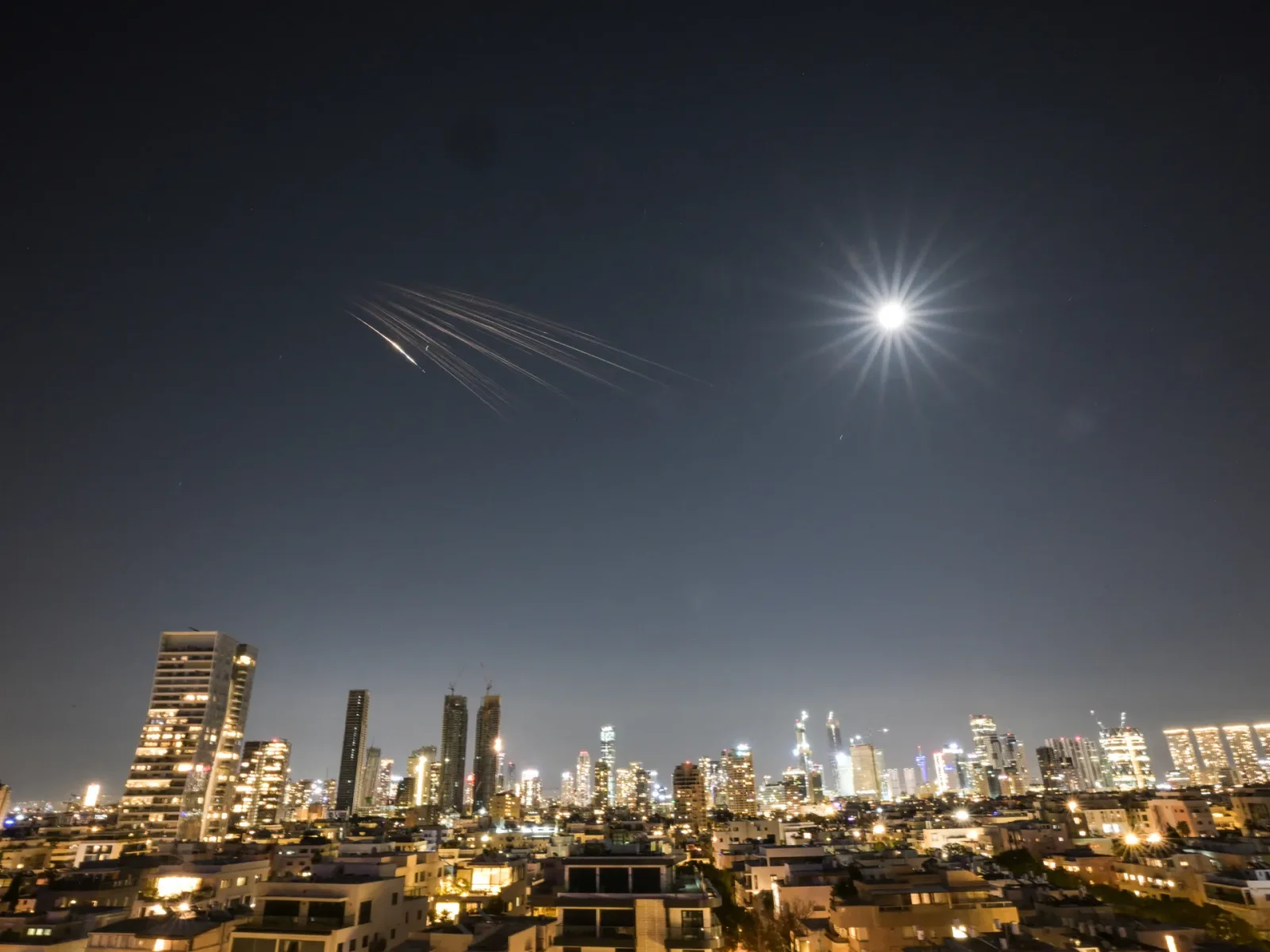 Iran fires cluster-munition missiles at central Israel in retaliation for Larijani’s death