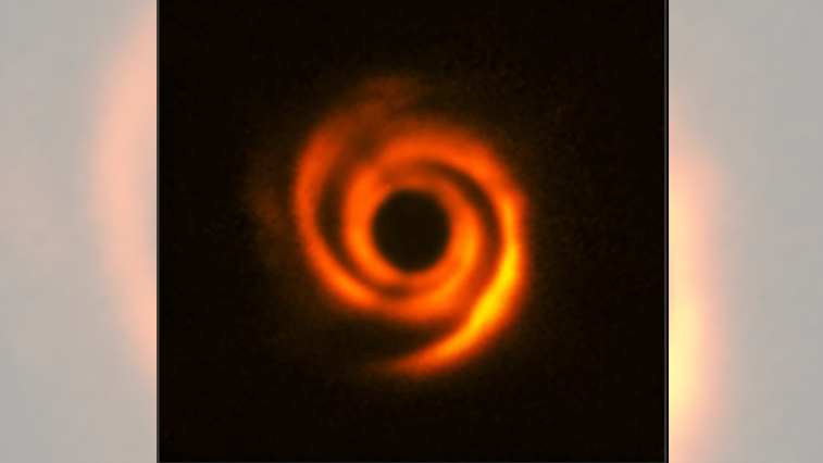 Featured image for Mysterious Star System Conceals Hidden Planet in Galaxy-like Arms