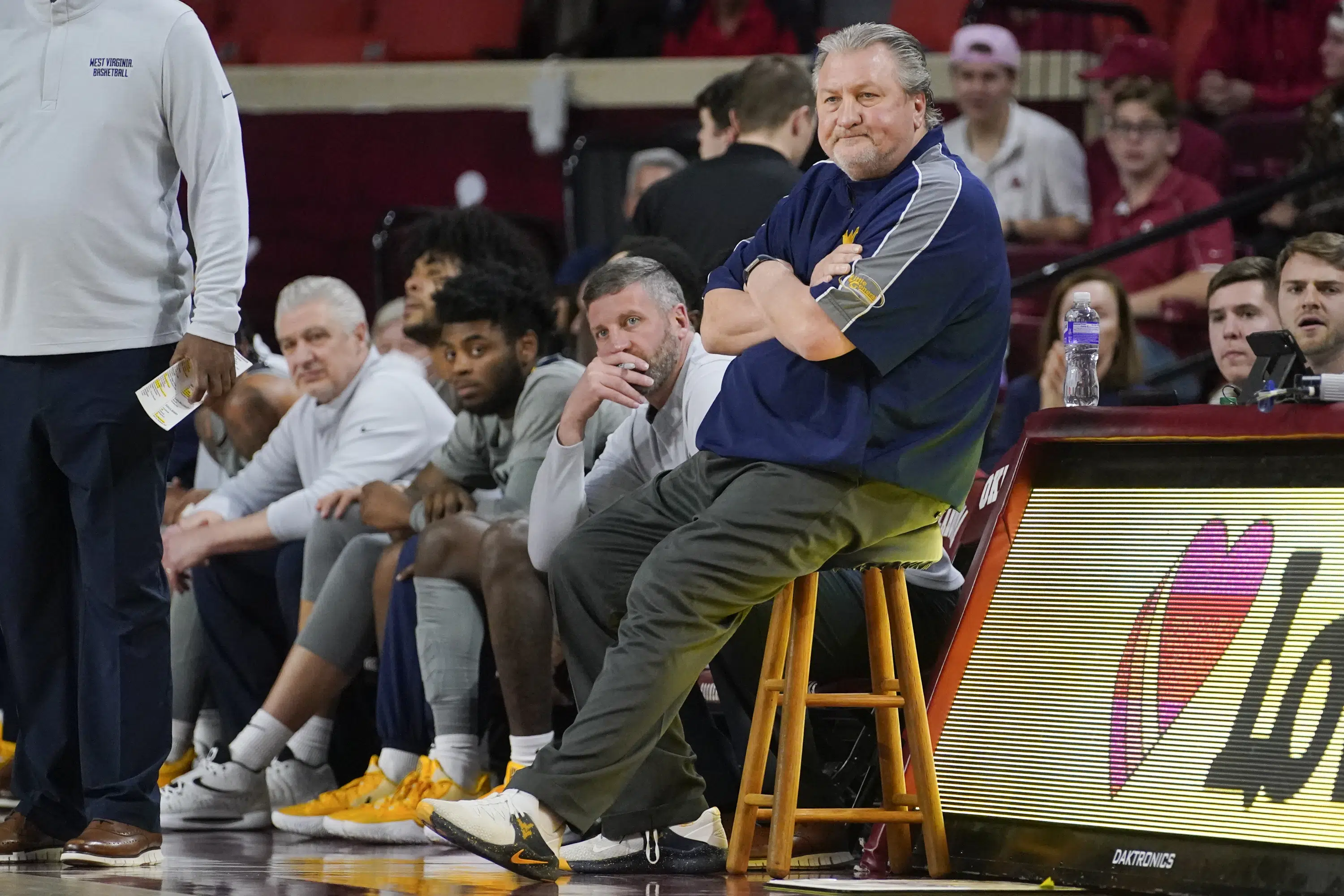 West Virginia names assistant Josh Eilert interim head coach, replacing Bob Huggins.