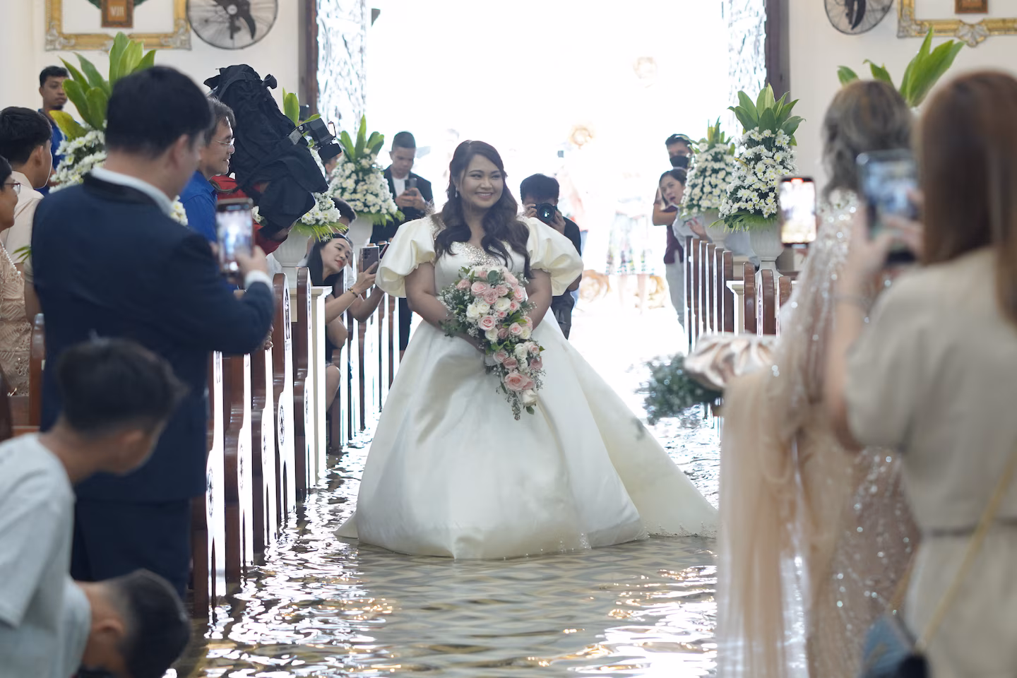 Featured image for "Love Conquers All: Bride's Resilience Shines Through Flooded Church Wedding in Typhoon-Hit Philippines"