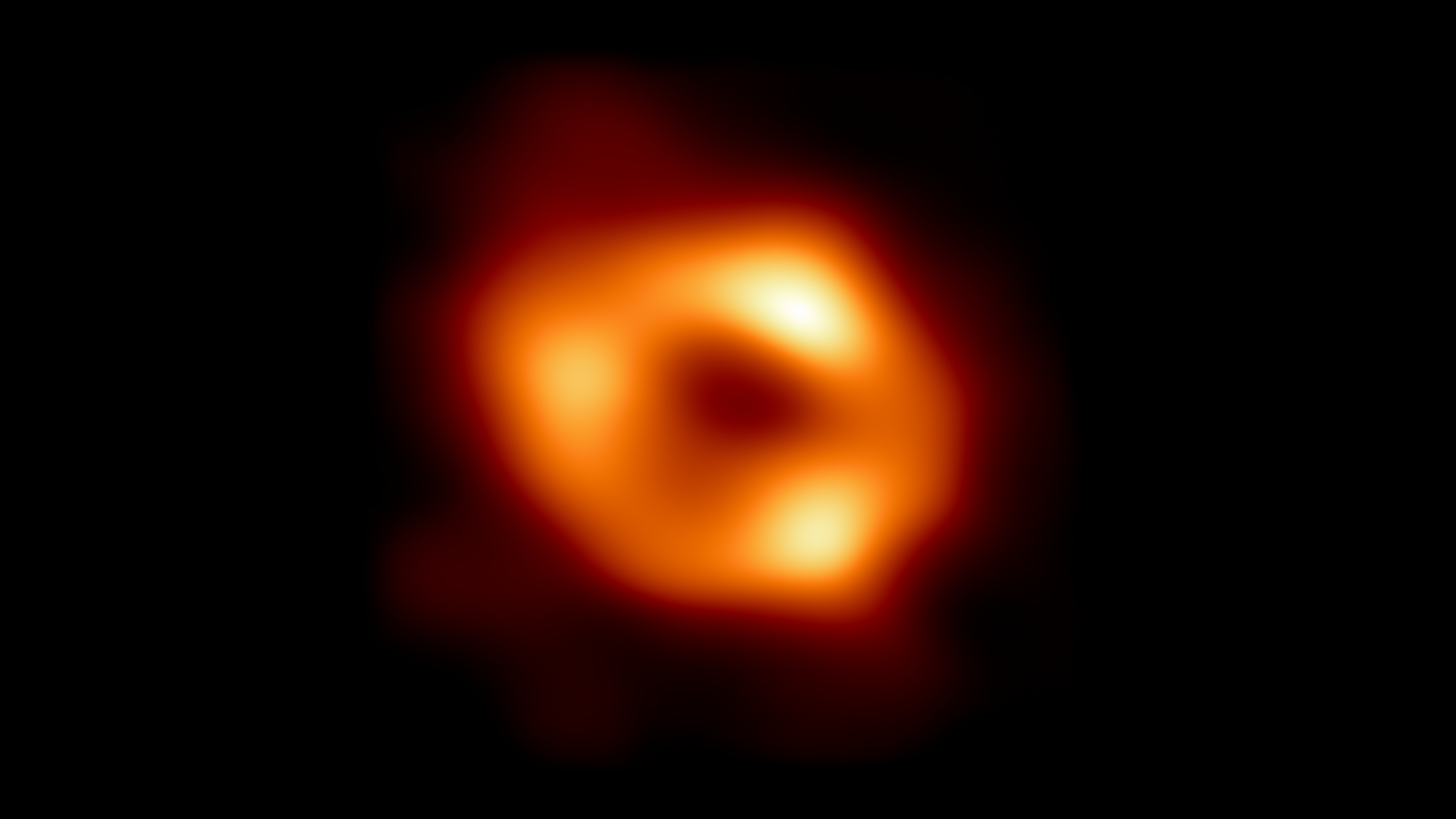 Featured image for "Milky Way's Black Hole Warps Spacetime into Football Shape"