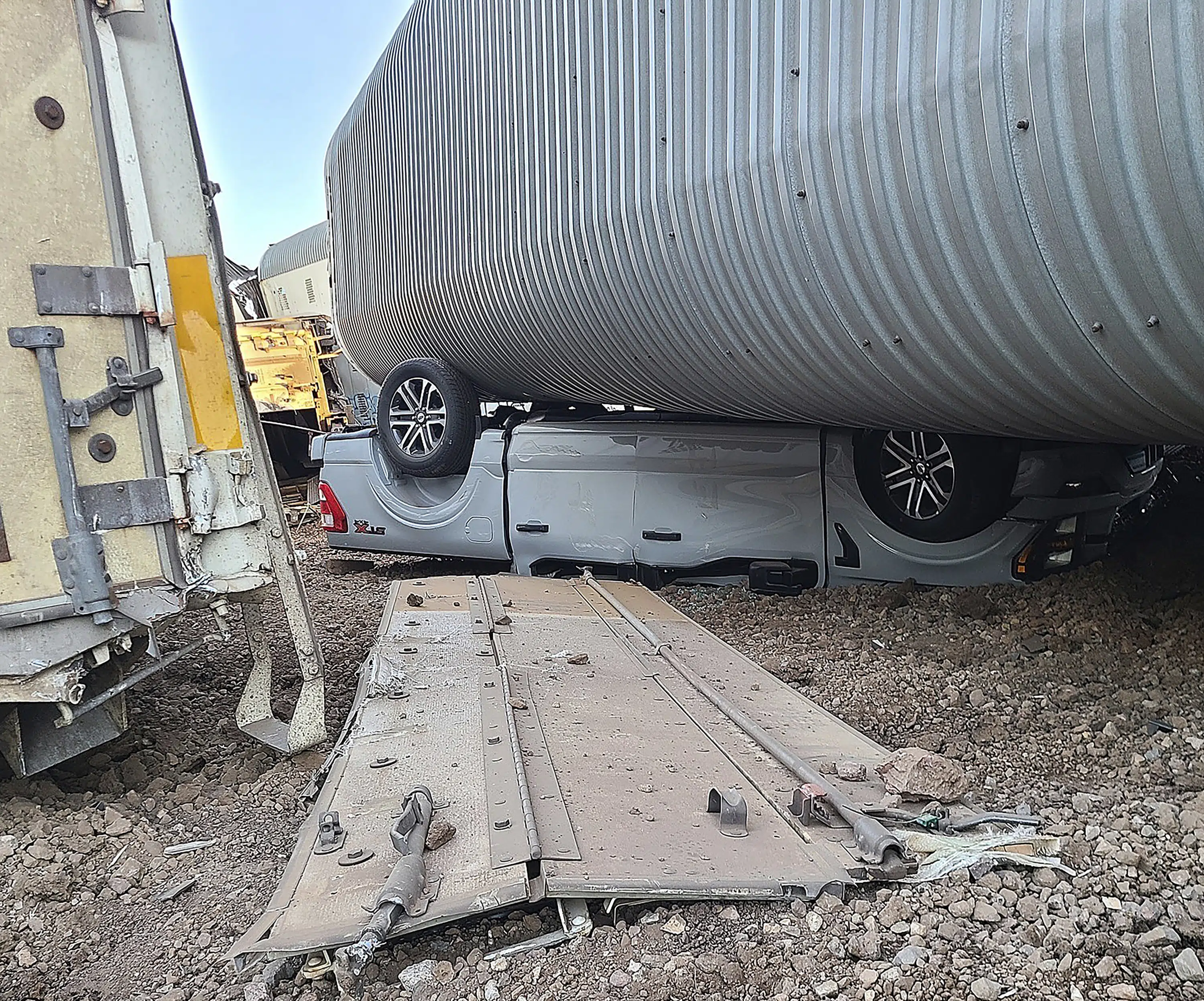 Featured image for Train derailment in northern Arizona causes extensive damage to freight cars and new vehicles.