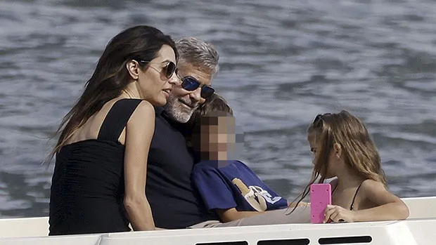 Featured image for George Clooney's Family Fun on Lake Como: Snuggles, Silver Dresses, and Summer Vacations
