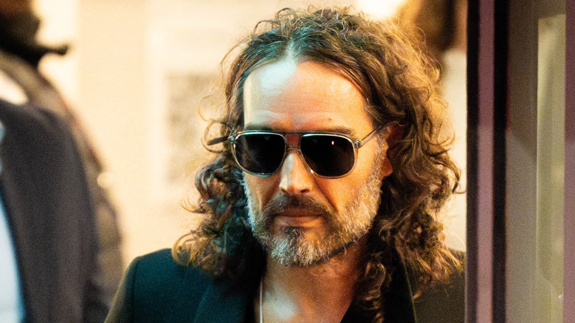 Featured image for Russell Brand's YouTube Revenue Suspended Amid Sexual Assault Allegations