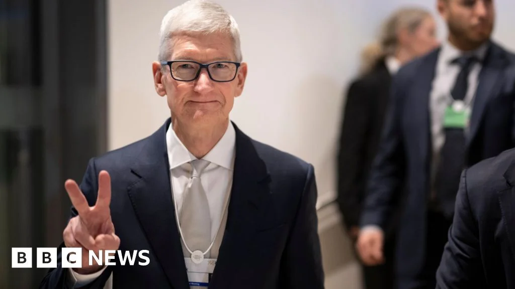 iPhone surge powers Apple to record quarterly revenue