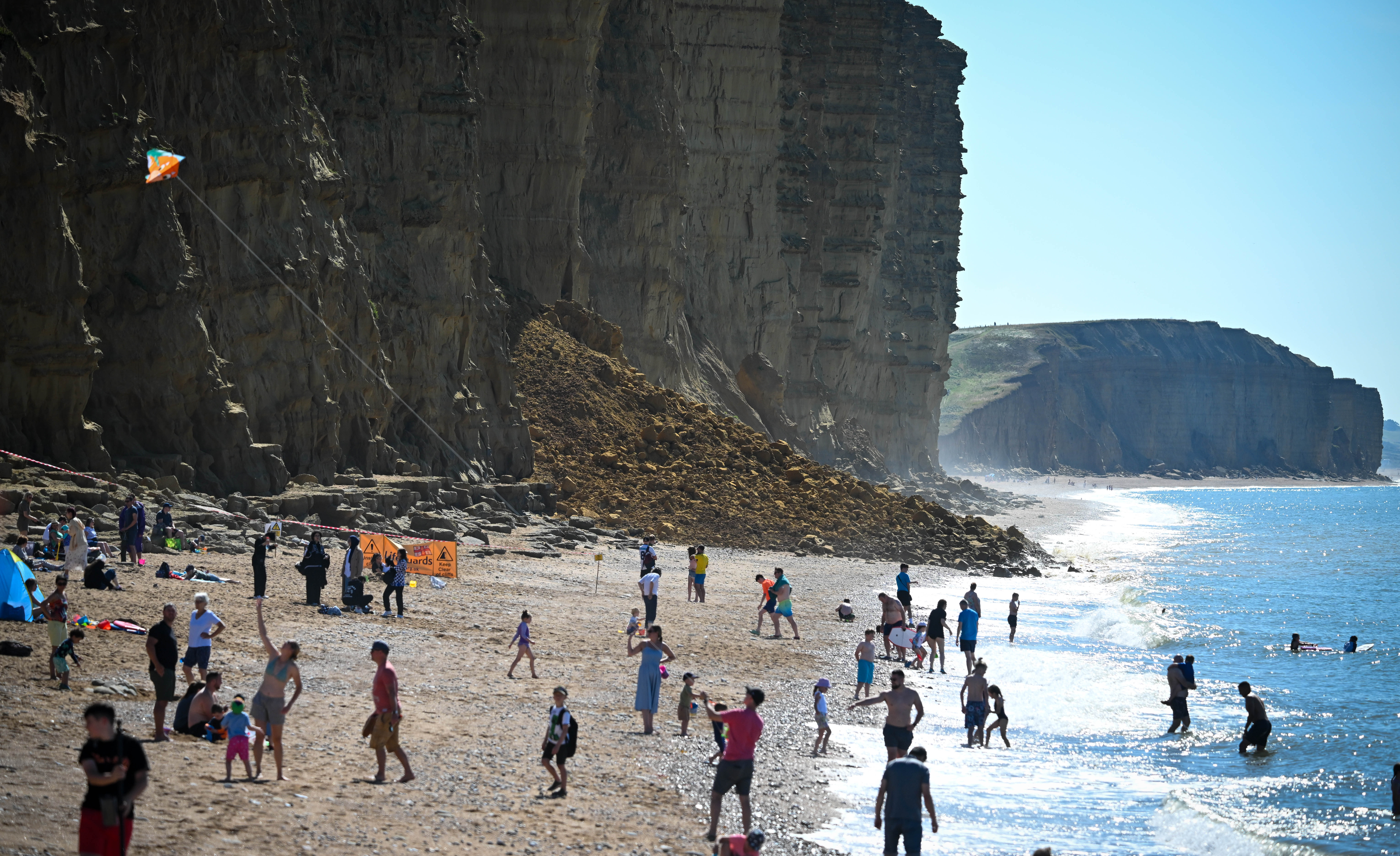Featured image for Miraculous Escape: Beachgoers Survive Terrifying Cliff Collapse