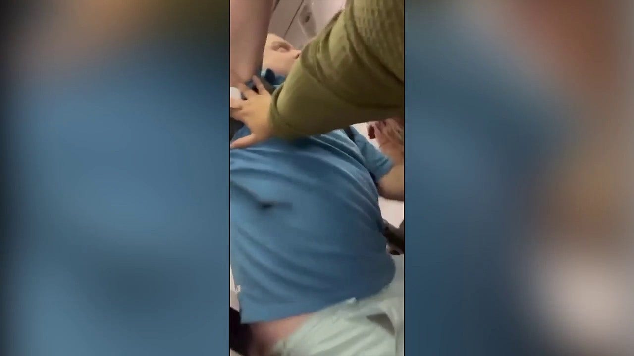 Unruly United Airlines passenger assaults crew and attempts to jump from plane.