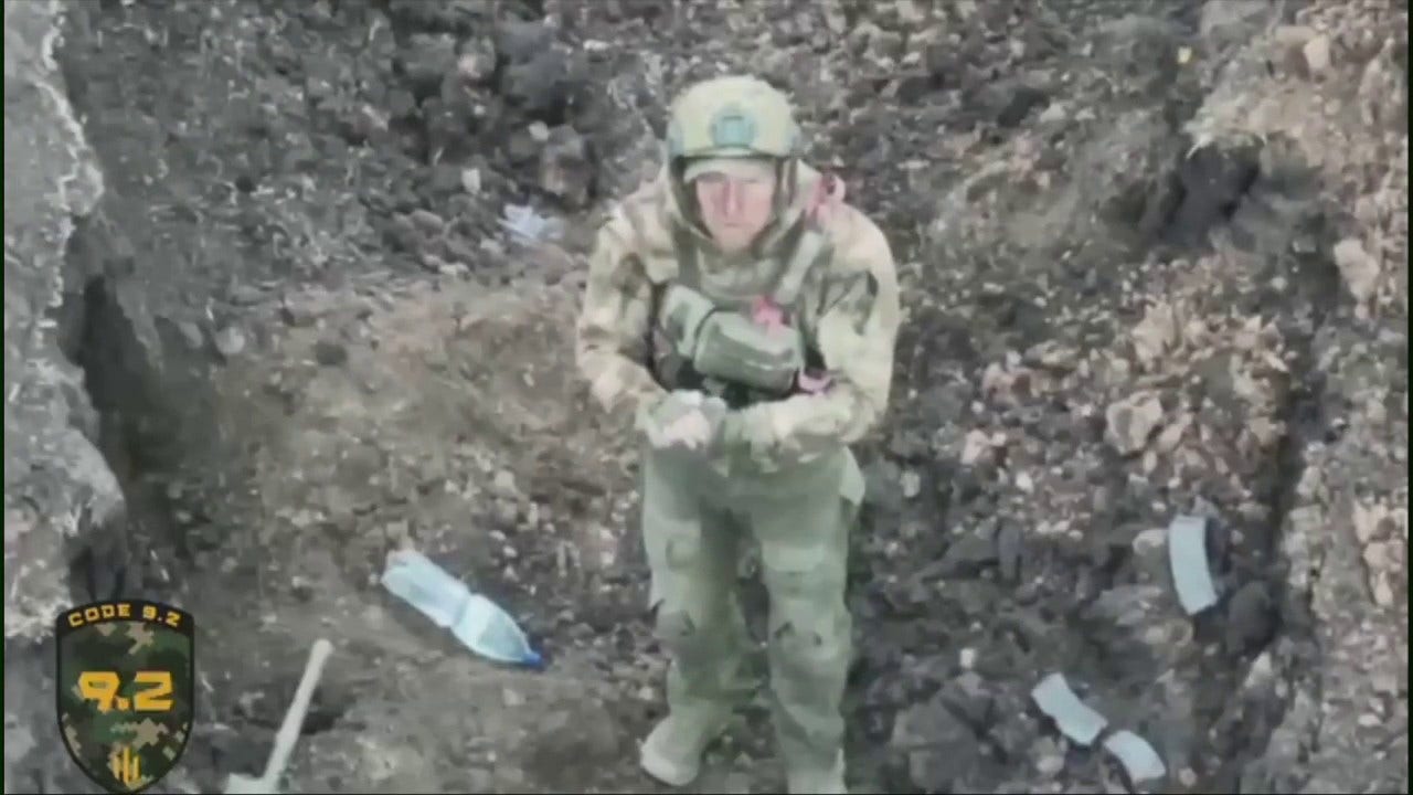Featured image for Russian soldier surrenders to Ukrainian drone in dramatic Bakhmut battlefield moment.