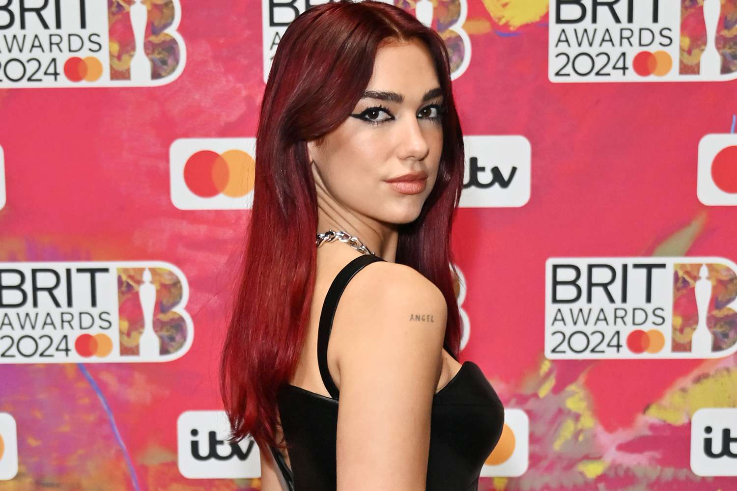 Featured image for "Dua Lipa Steals the Show at 2024 BRIT Awards: A Night of Wins and Glamour"