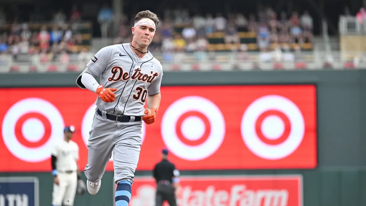 Tigers secure 6-4 win over division-leading Twins with back-to-back homers and bullpen support.