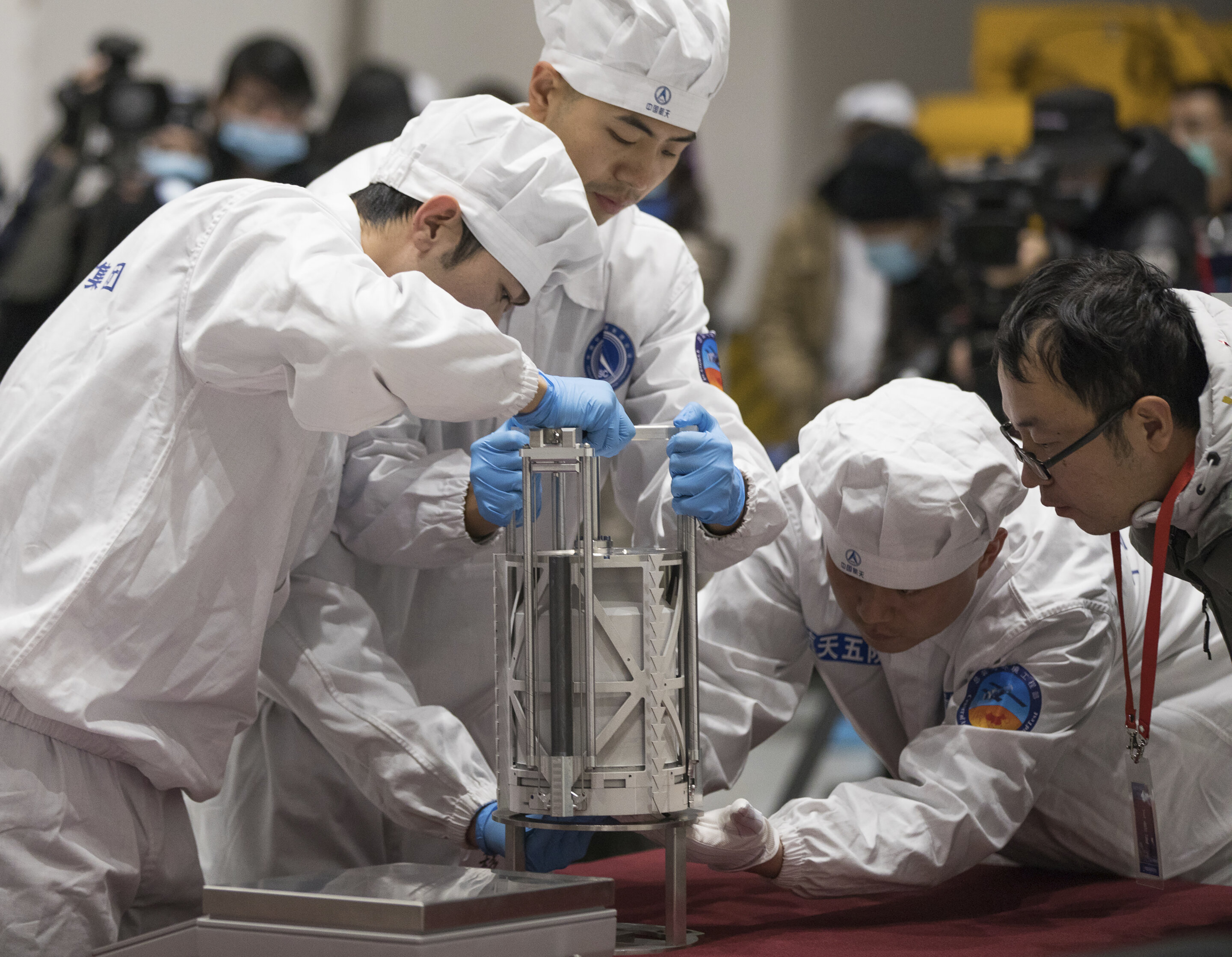 Chinese mission discovers water-rich glass beads on the moon.