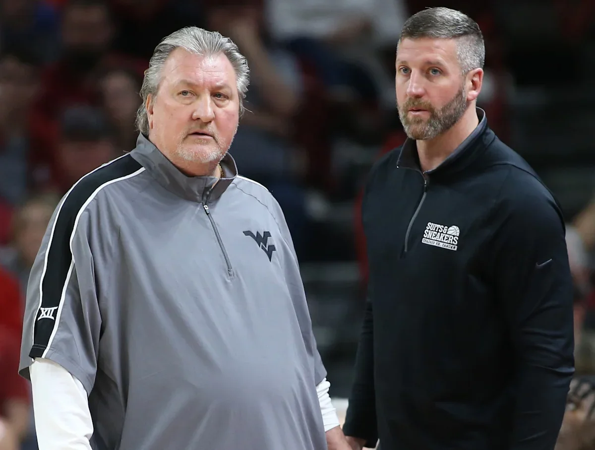 Josh Eilert named interim head coach for WVU men's basketball team.