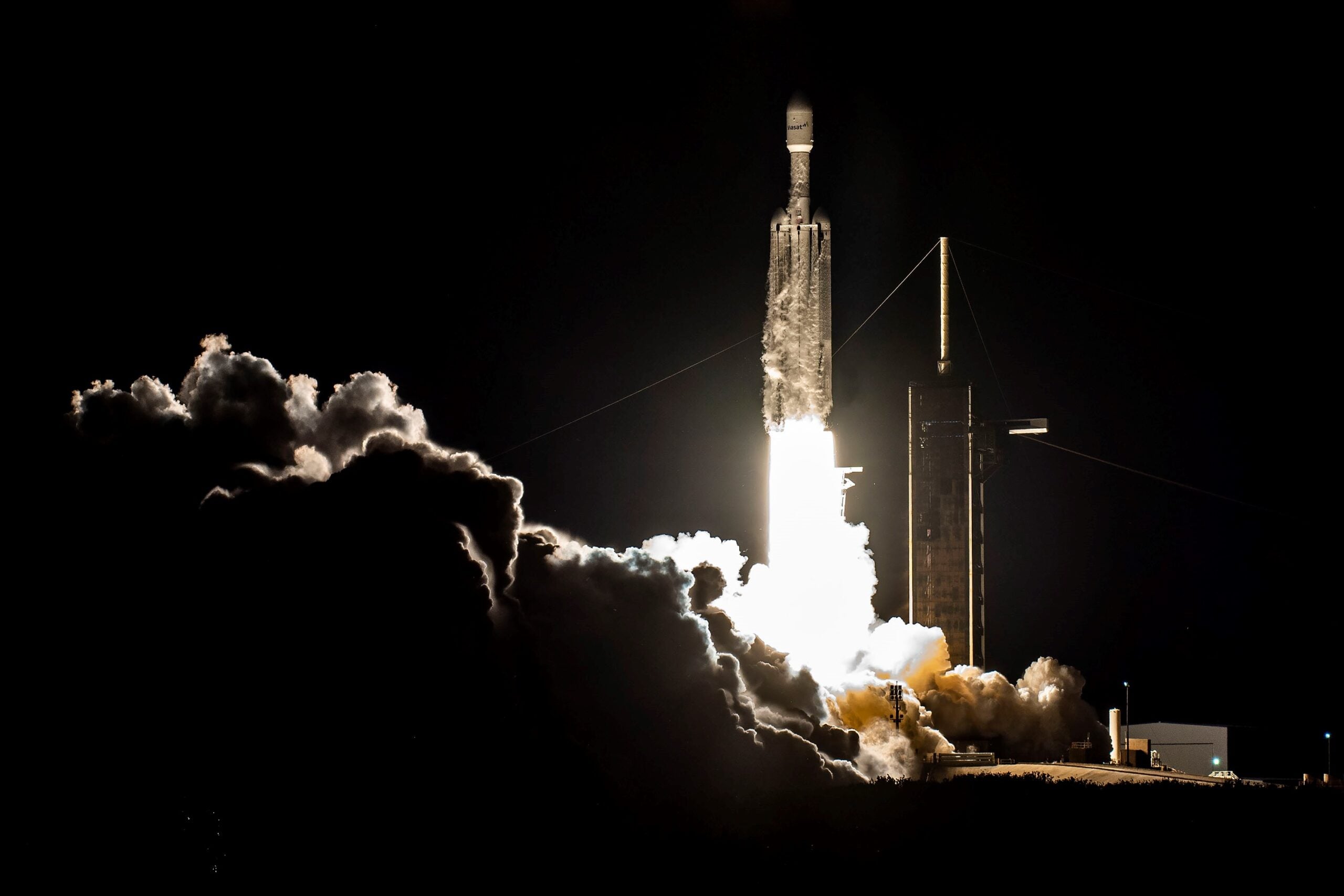 SpaceX's Falcon Heavy successfully launches ViaSat-3 satellite amidst weather delays.