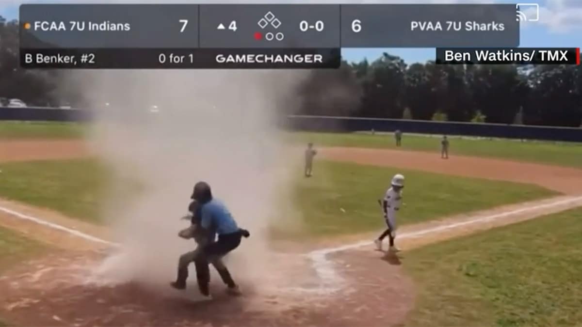 Featured image for Umpire saves catcher from dust devil during Florida little league game.