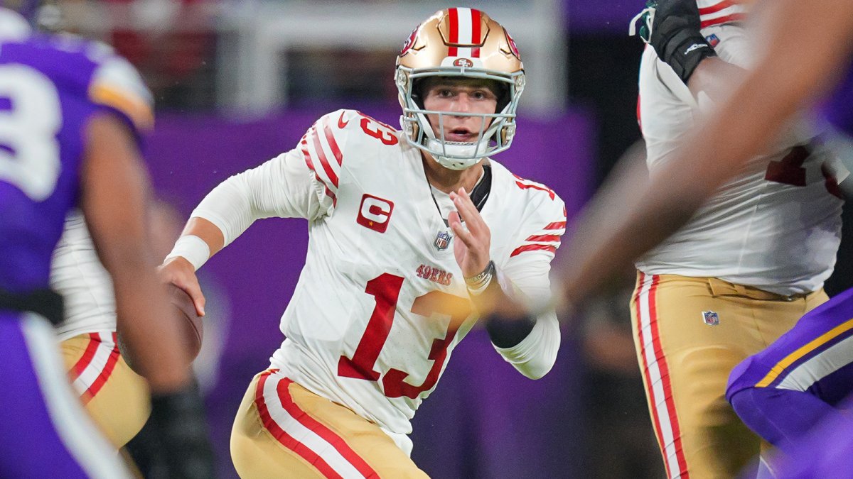 "Warner and Purdy's Post-Game Conversation Sparks Speculation on Cousins' Future"