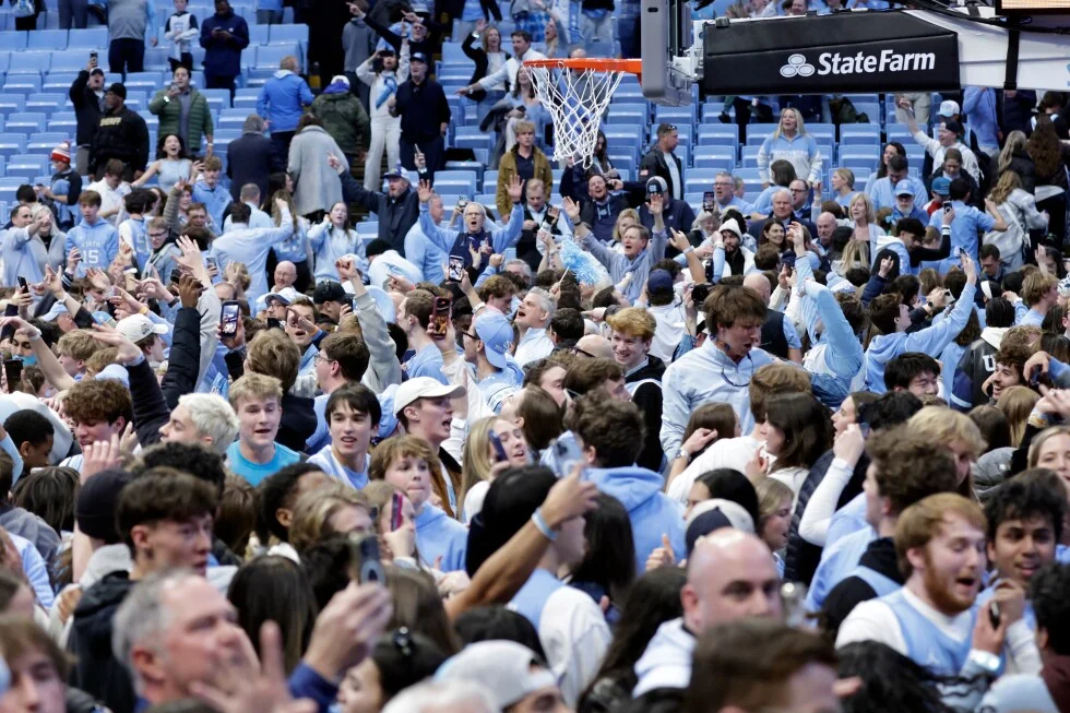 UNC win sparks chaotic court-storming as Duke staff were punched.