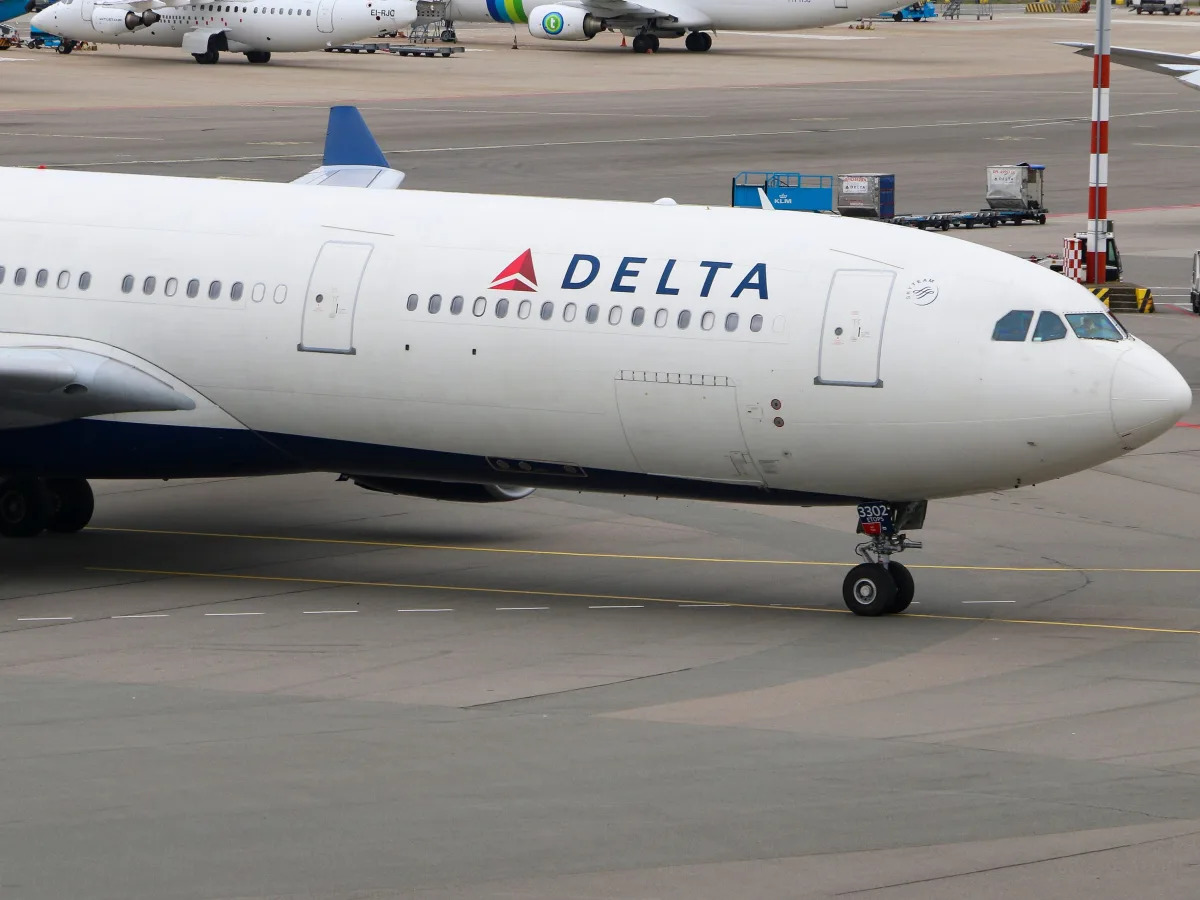 Delta flight diverted to Canada due to unruly passenger breaking free from restraints.