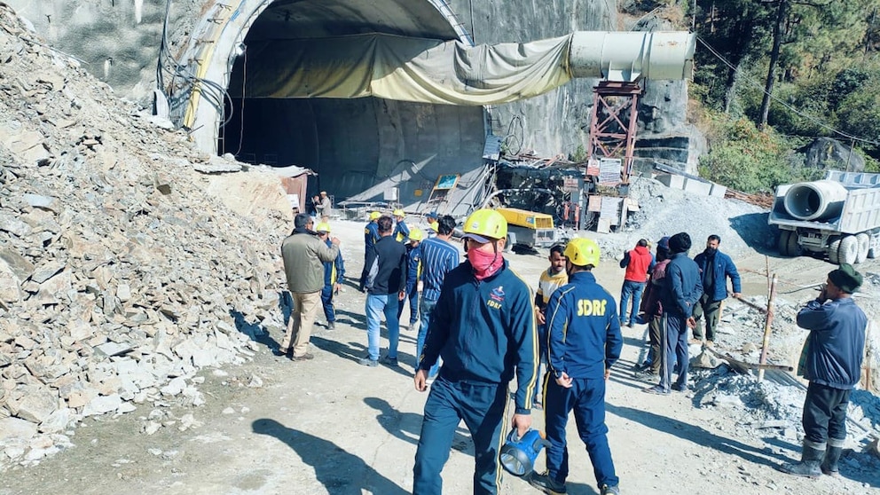 "Race Against Time: Rescuers Battle to Free Trapped Workers in India's Collapsed Tunnel"