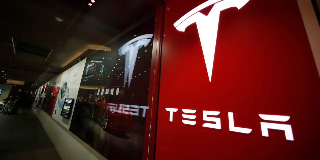 Tesla's net income drops 24% as stock slide rattles carmakers.