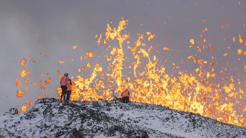 Iceland's Reykjanes Peninsula: Volcano Erupts, Threatening Town and Captivating with Lava Show