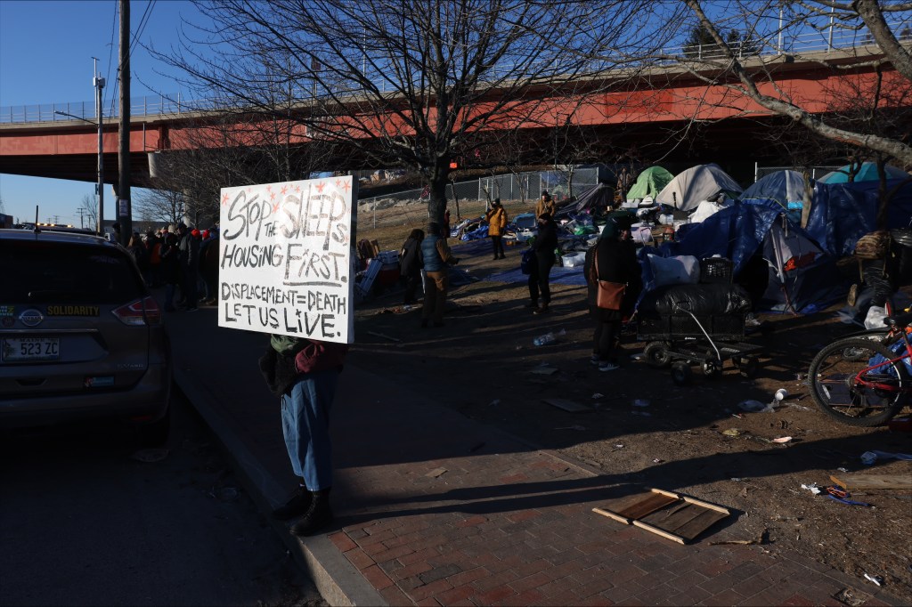 Featured image for "Human Chain Emerges at Harbor View Encampment as Sweep Looms"