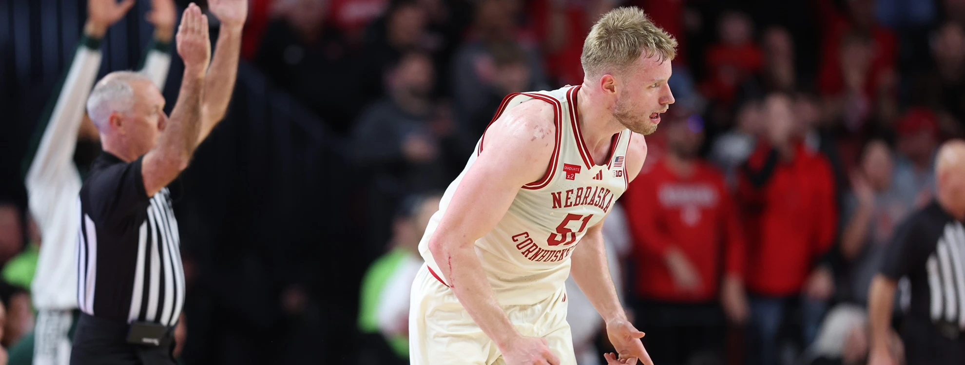 Featured image for Nebraska Huskers Defeat No. 9 Michigan State, Fans Urged to Cease Court Storming