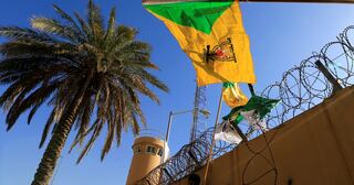 "Iraq's Kataib Hezbollah Suspends Attacks on US Forces Amid Rising Tensions"