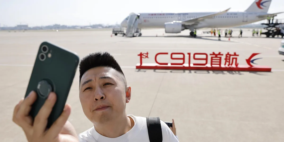Featured image for China's C919 completes inaugural commercial flight, challenging Airbus and Boeing's dominance.