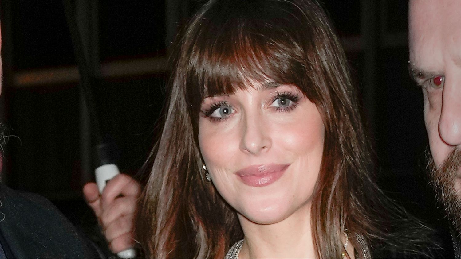 "Dakota Johnson Stuns in Plunging Black Jumpsuit on 'SNL'"