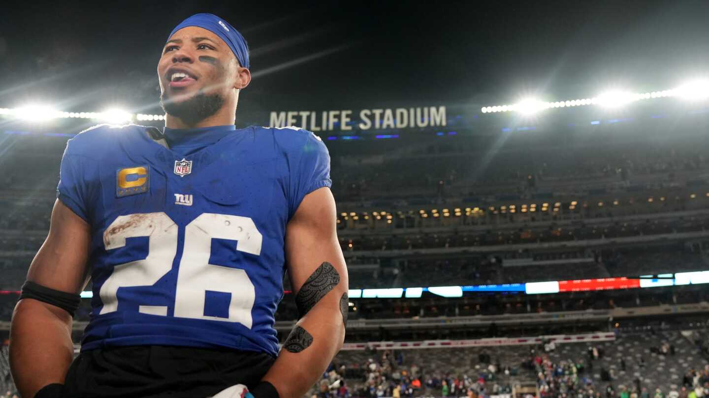 Featured image for "Feud Flares: Tiki Barber and Saquon Barkley Clash Over Giants Departure"