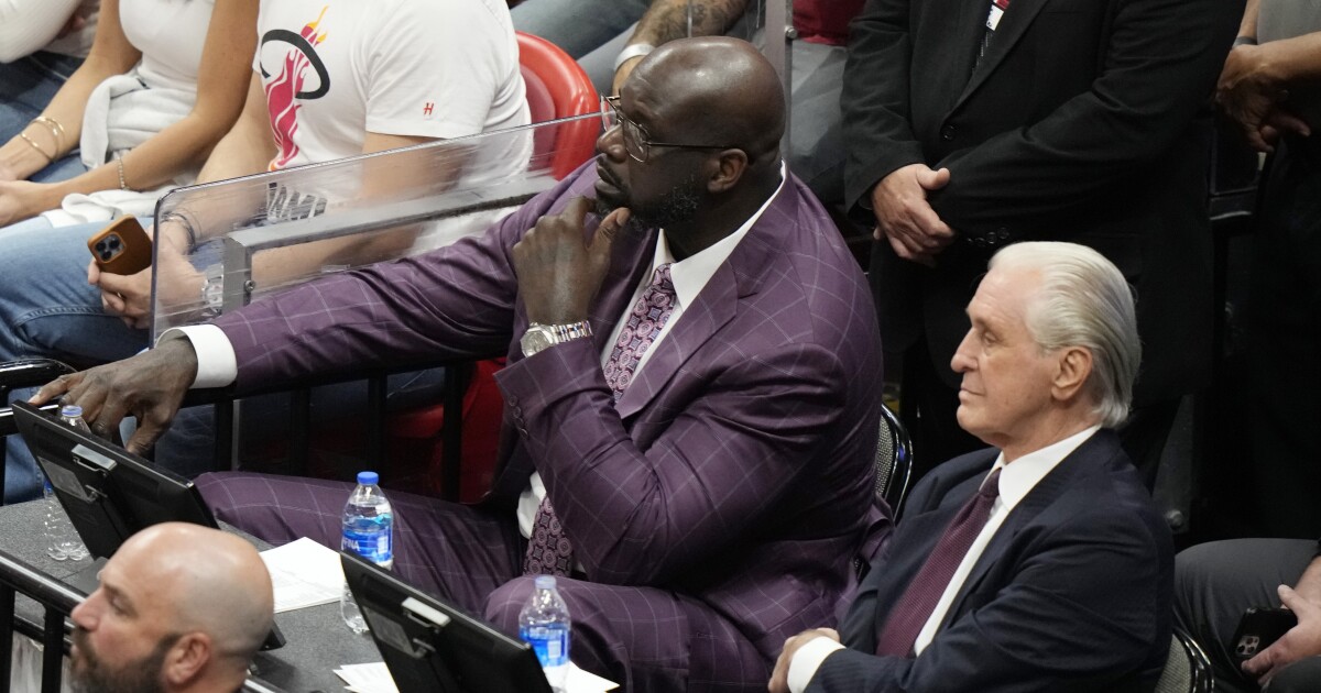 Shaq served court papers during NBA playoff game.