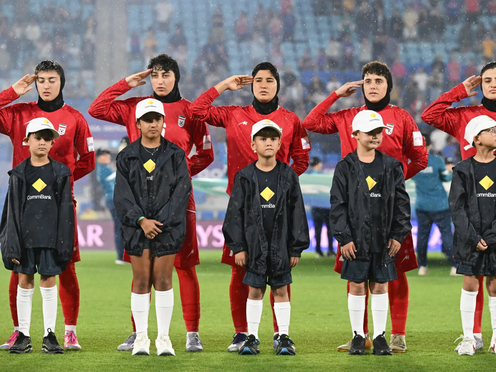 Iran women’s football team sings anthem in Australia amid safety fears