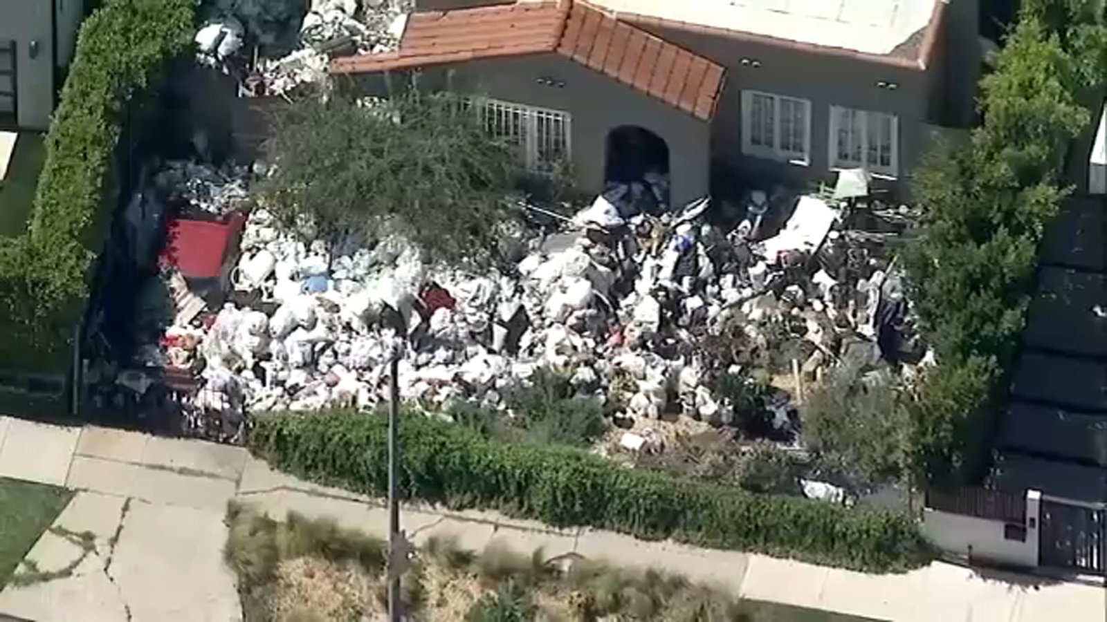 Featured image for "Neighbors Rally for Action as Trash Piles Up Outside L.A. Home"