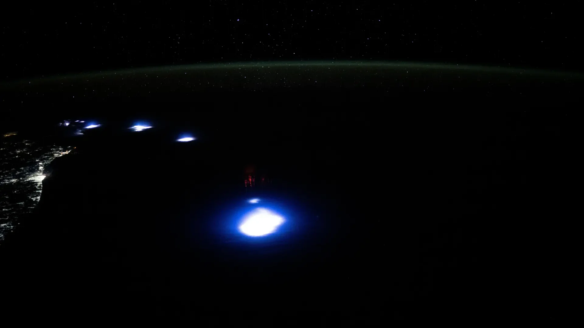 Featured image for Astronauts Capture Mysterious Glowing Orbs and Red Sprites from Space