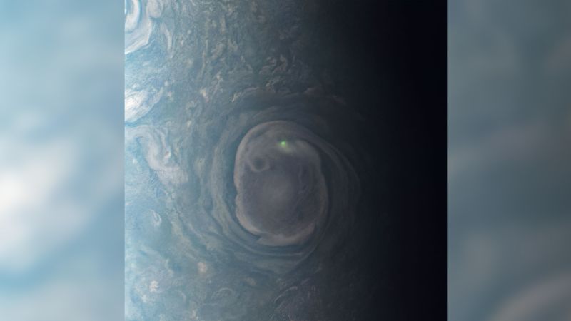 Juno spacecraft captures rare neon green lightning on Jupiter's north pole.